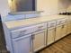Stylish kitchen featuring modern white cabinetry and tiled countertops at 3168 S Eastern Ave # 45, Las Vegas, NV 89169