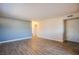 Spacious living room featuring wood-style tile flooring and neutral paint at 3168 S Eastern Ave # 45, Las Vegas, NV 89169