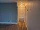 Spacious living room with tile floors and blue accent wall at 3168 S Eastern Ave # 45, Las Vegas, NV 89169