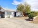 Charming single-story home featuring a desert-friendly landscaped front yard and a cozy front porch with seating at 424 N 16Th St, Las Vegas, NV 89101