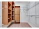 Large walk-in closet providing ample storage space with built in shelving at 7908 Morning Gallop Ct, Las Vegas, NV 89131