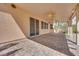 A brick-paved covered patio with a ceiling fan offers a relaxed outdoor retreat at 7908 Morning Gallop Ct, Las Vegas, NV 89131