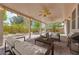 This covered patio offers an outdoor living space, ceiling fans, and access to a well-maintained backyard at 7908 Morning Gallop Ct, Las Vegas, NV 89131