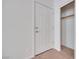 Interior view of a six panel door leading to a closet with lighting and shelving at 7908 Morning Gallop Ct, Las Vegas, NV 89131