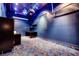 Entertainment room features a custom carpet, desk and shelving, and projector setup at 7908 Morning Gallop Ct, Las Vegas, NV 89131