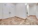 Welcoming foyer with decorative double doors and neutral tile flooring at 7908 Morning Gallop Ct, Las Vegas, NV 89131