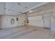 Well-lit garage with built-in storage cabinets, utility sink, and space for vehicles and projects at 7908 Morning Gallop Ct, Las Vegas, NV 89131
