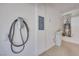 Garage with installed electric vehicle charger, water heater, water softener and overhead shelving at 7908 Morning Gallop Ct, Las Vegas, NV 89131