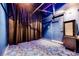 This home theater features ambient lighting, decorative flooring, and a large screen for immersive entertainment at 7908 Morning Gallop Ct, Las Vegas, NV 89131