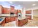 The kitchen boasts granite countertops, stainless steel appliances, and ample storage at 7908 Morning Gallop Ct, Las Vegas, NV 89131