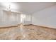 Bright living room with chandelier and views to foyer and other living areas at 7908 Morning Gallop Ct, Las Vegas, NV 89131
