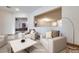 Living room showcasing open layout and views to kitchen and dining area at 7908 Morning Gallop Ct, Las Vegas, NV 89131