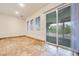 Bright sunroom with sliding glass doors and view of the outdoor space at 7908 Morning Gallop Ct, Las Vegas, NV 89131