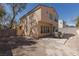 Wide-angle backyard view features large wall surround and open space at 8516 Montago Valley Ave, Las Vegas, NV 89117