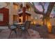 Inviting backyard patio with seating area with view of the exterior, complemented by mature trees and tranquil atmosphere at 8516 Montago Valley Ave, Las Vegas, NV 89117
