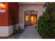 Front entrance featuring an arched entryway, leading to a well-lit interior with neutral finishes and tile flooring at 8516 Montago Valley Ave, Las Vegas, NV 89117