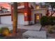 Charming two-story home with a well-manicured desert landscape and three car garage with a walkway to the front door at 8516 Montago Valley Ave, Las Vegas, NV 89117
