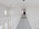 Hallway with neutral carpet, white walls, and a view into another room at 8516 Montago Valley Ave, Las Vegas, NV 89117