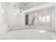 Expansive living area featuring plush carpeting, natural light, and an open layout connecting to the second floor at 8516 Montago Valley Ave, Las Vegas, NV 89117