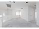Neutral open living space with carpet, bright white walls and many windows with natural light at 8516 Montago Valley Ave, Las Vegas, NV 89117