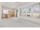 Bright living space with plush carpet, open kitchen and light wood cabinets at 8516 Montago Valley Ave, Las Vegas, NV 89117