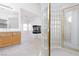 Primary bathroom with glass block shower, dual sink vanity and an open layout at 8516 Montago Valley Ave, Las Vegas, NV 89117