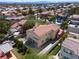 A beautiful residence is surrounded by a secure backyard that features a patio and vibrant greenery, offering plenty of space at 8516 Montago Valley Ave, Las Vegas, NV 89117