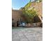 The backyard features a paved area with a decorative garden and landscape at 8920 Appellation Ave, Las Vegas, NV 89148