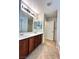 Bathroom with double sinks, wood cabinets, and a shower and tub combo at 8920 Appellation Ave, Las Vegas, NV 89148
