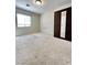 Bedroom with carpet, window, and a mirrored closet, offering a comfortable retreat at 8920 Appellation Ave, Las Vegas, NV 89148