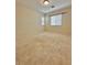 Bare bedroom with neutral carpet and two windows for natural light at 8920 Appellation Ave, Las Vegas, NV 89148