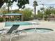 Resort-style community pool and spa area, complete with lounge chairs, shade, and lush landscaping at 8920 Appellation Ave, Las Vegas, NV 89148