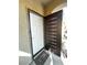 View of the front door which includes a screen door with horizontal bars at 8920 Appellation Ave, Las Vegas, NV 89148