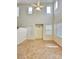 Bright living room featuring a high ceiling, fan, neutral walls, and tile flooring at 8920 Appellation Ave, Las Vegas, NV 89148