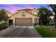 Charming two-story home with a well-manicured lawn, attached garage, and an extended driveway at 9409 Kayla Ct, Las Vegas, NV 89134