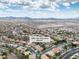 An aerial view of a residential neighborhood in Nevada, featuring mountains and desert in the background at 1501 Via Salaria Ct, Henderson, NV 89052