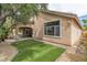 This house offers backyard views of lush landscaping and a covered patio at 1501 Via Salaria Ct, Henderson, NV 89052