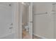 Cozy bathroom with a toilet, shower with tub, and tiled floor at 1501 Via Salaria Ct, Henderson, NV 89052