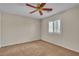 Bedroom featuring a ceiling fan and window with shutters at 1501 Via Salaria Ct, Henderson, NV 89052
