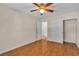 Bedroom with ceiling fan, and closets, featuring wood-look flooring at 1501 Via Salaria Ct, Henderson, NV 89052