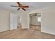 Bedroom with ceiling fan, mirrored closet, and multiple doors at 1501 Via Salaria Ct, Henderson, NV 89052