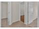 Hallway with carpet flooring leading to rooms with wood or carpet at 1501 Via Salaria Ct, Henderson, NV 89052