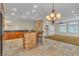 Kitchen featuring stainless steel appliances, stone accents and bar seating at 1501 Via Salaria Ct, Henderson, NV 89052
