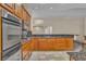 Updated kitchen with stainless steel appliances, granite counters and tile floors at 1501 Via Salaria Ct, Henderson, NV 89052
