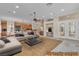 Open-concept living area with fireplace, large sofa, and easy access to kitchen area at 1501 Via Salaria Ct, Henderson, NV 89052