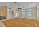 Expansive living room with carpet flooring, a stone fireplace, and French doors to the patio at 1501 Via Salaria Ct, Henderson, NV 89052