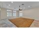 A spacious living area with carpet flooring, large windows, and recessed lighting at 1501 Via Salaria Ct, Henderson, NV 89052
