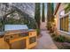 Backyard area with built-in grill and access to the home with manicured landscaping at 1501 Via Salaria Ct, Henderson, NV 89052