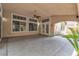 The covered patio offers tile flooring and backyard views through multiple windows at 1501 Via Salaria Ct, Henderson, NV 89052