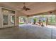 Spacious covered patio features a ceiling fan, tiled flooring, and charming water fountain at 1501 Via Salaria Ct, Henderson, NV 89052